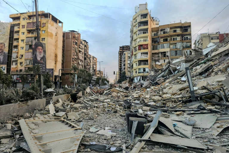 Photo for story: The rubble of a destroyed building at the site of an overnight Israeli airstrike in Beirut's southern suburbs on March 28, 2026