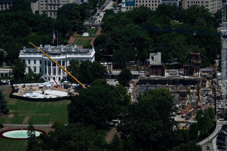 Photo for story: The ongoing construction of a helipad (L) and ballroom (R) at the White House are two of US President Donald Trump's many projects intended to leave a mark on Washington by the time he concludes his second term in January 2029