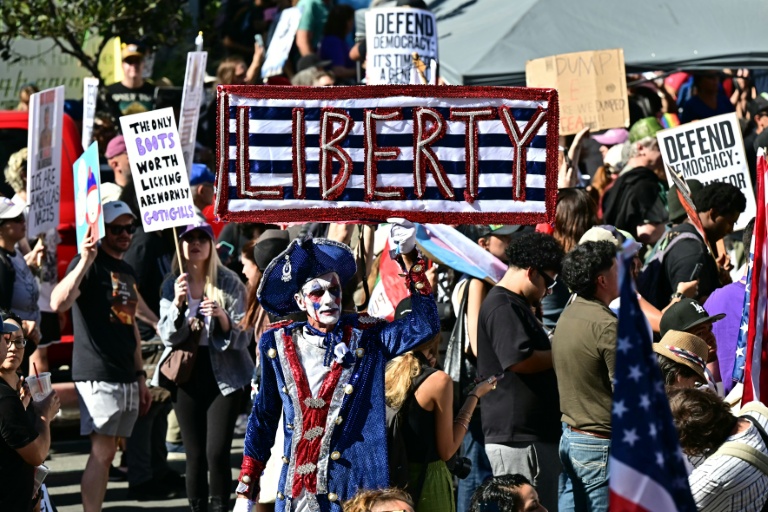 Photo for story: Protesters in Los Angeles during the 'No Kings' rally across the United States on October 18, 2025