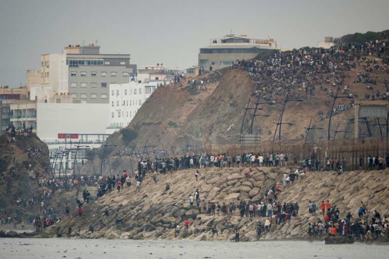 Photo for story: Dramatic images from the Spanish territory of Ceuta, on the Moroccan coast, are fueling far-right warnings over immigration
