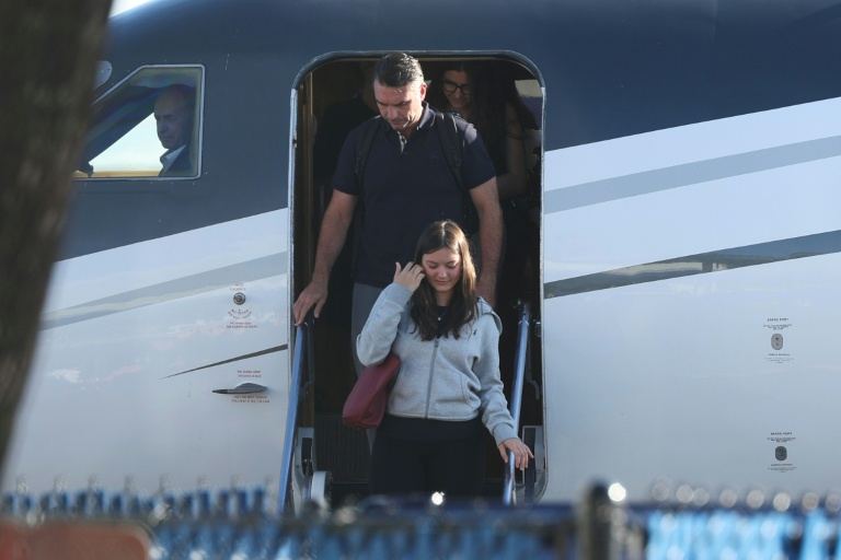 Photo for story: Flavio Bolsonaro steps off a plane after arriving at Opa Locka Executive Airport in Miami, Florida on October 28, 2026